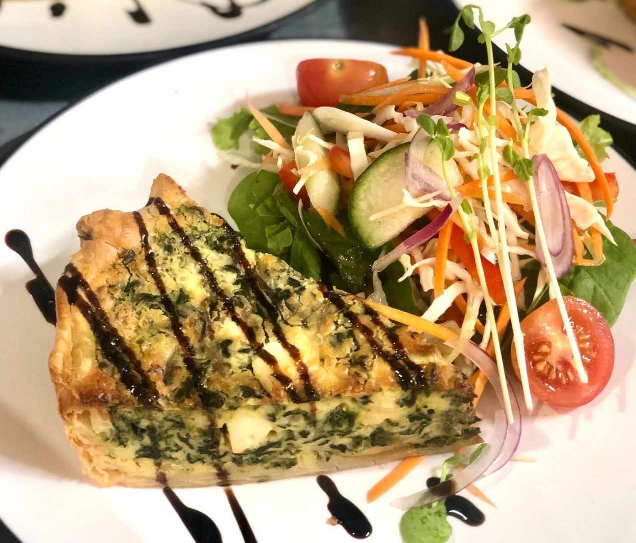 A Slice of Quiche Drizzled With Sauce, Served — Flour in Yeppoon, QLD