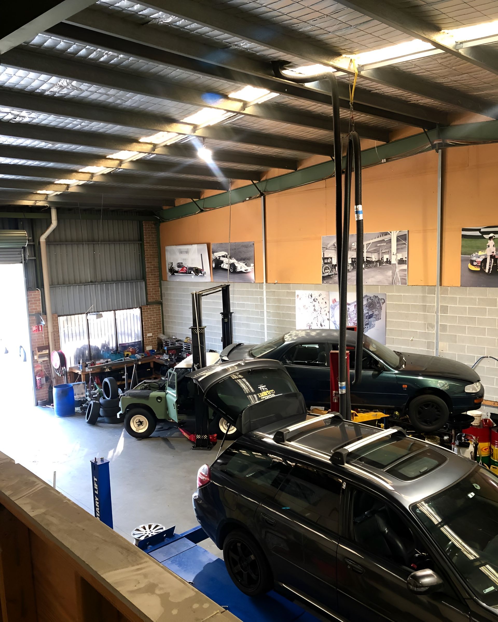 The Engine of a Red Car With the Hood Open — Autochange Mechanical Repairs & Tyres in Bellambi, NSW