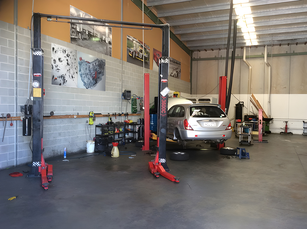 A Car Being Worked on Inside an Auto Repair Shop — Autochange Mechanical Repairs & Tyres in Bellambi, NSW