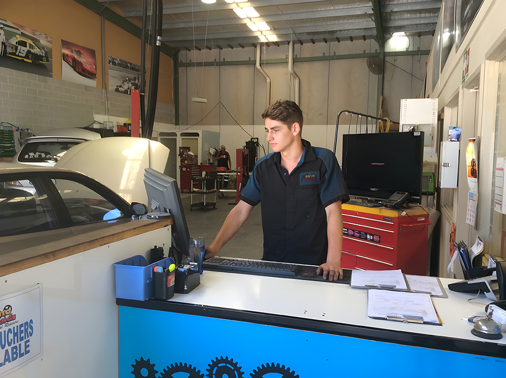 A Man Works in Auto Repair Shop — Autochange Mechanical Repairs & Tyres in Bellambi, NSW