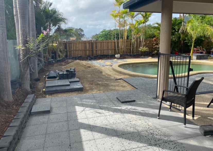Concrete Pavers Getting Installed Around Pool — Trinity Landscape in Cairns, QLD