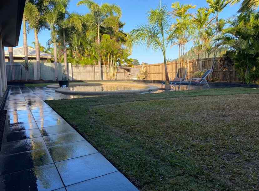 Backyard After Pavers Installed with Grass Patch — Trinity Landscape in Cairns, QLD