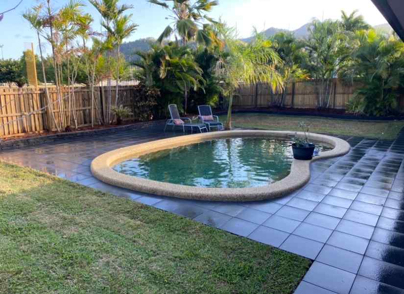 Swimming Pool Surrounds After Landscaping — Trinity Landscape in Cairns, QLD