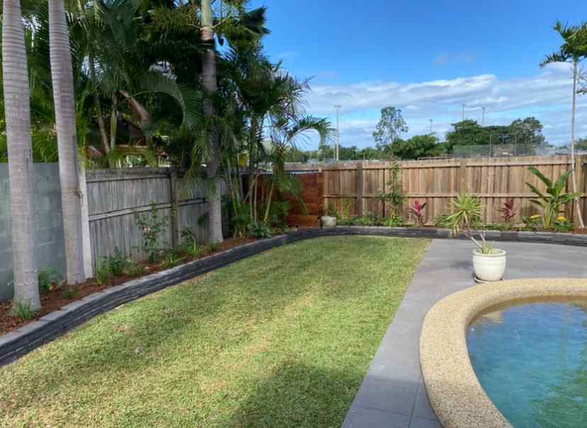 Backyard with Garden Bed & Turf — Trinity Landscape in Cairns, QLD