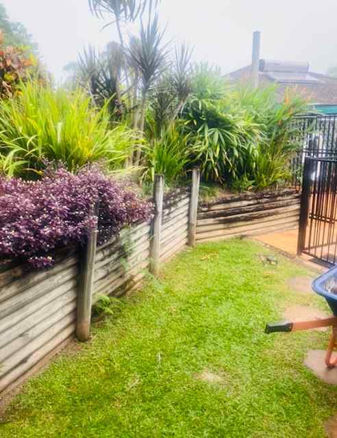 Wooden Retaining Wall with Garden Bed — Trinity Landscape in Cairns, QLD