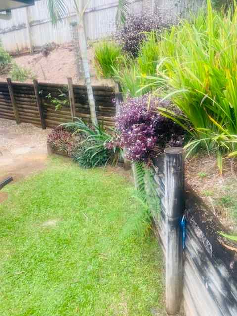 Wooden Retaining Wall with Garden  — Trinity Landscape in Cairns, QLD