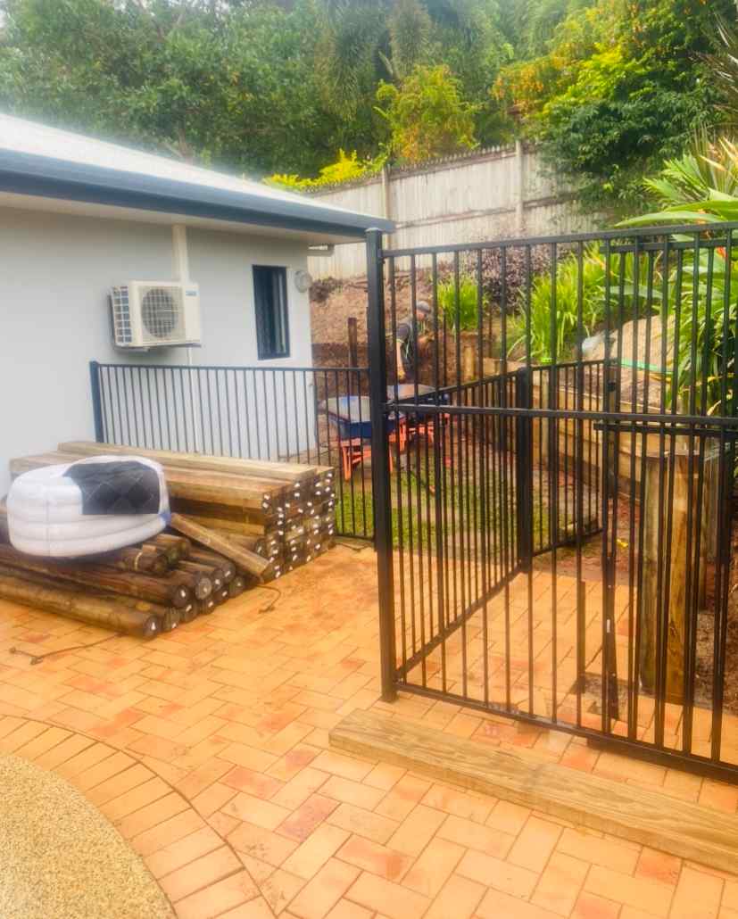 Orange Pavers & Black Fence  — Trinity Landscape in Cairns, QLD