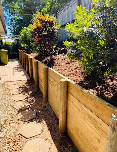 Wooden Retaining Wall & Garden Bed After Renovation  — Trinity Landscape in Cairns, QLD