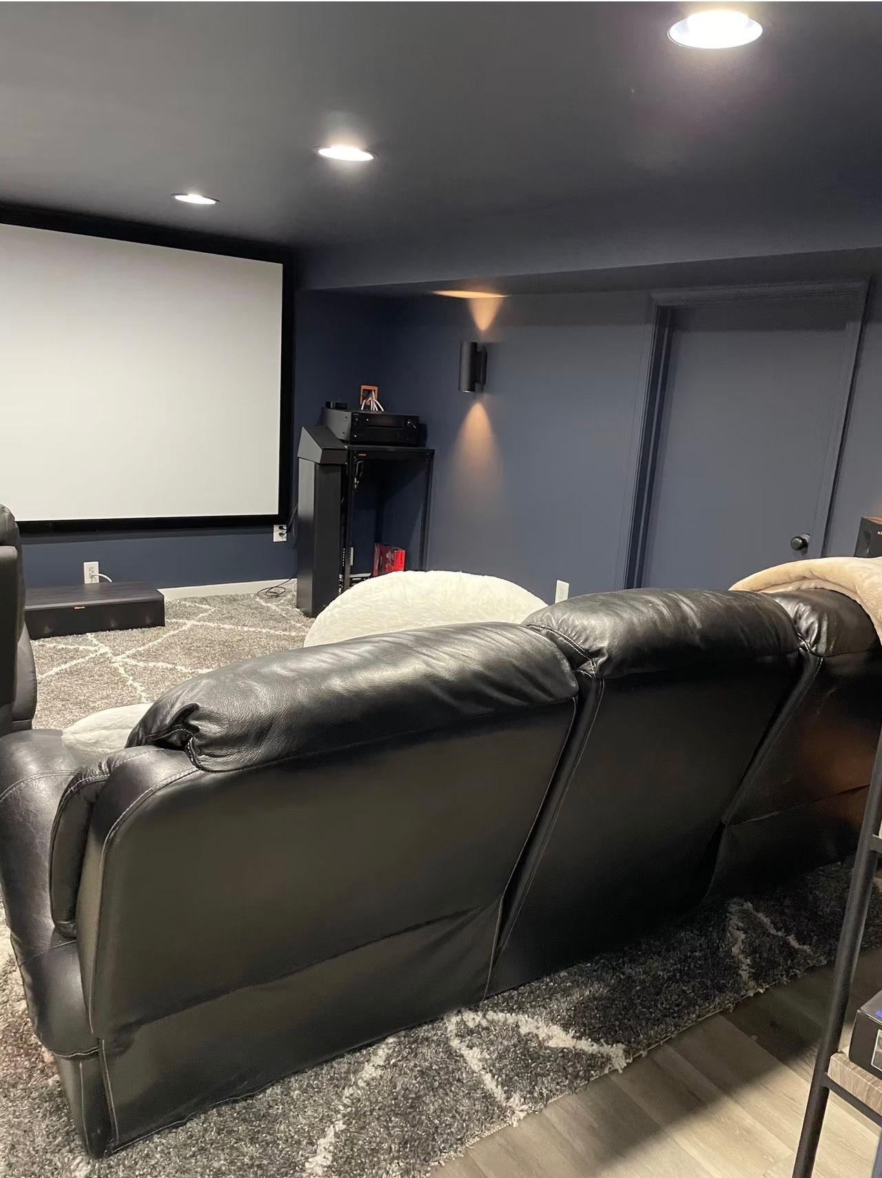 A basement renovation in Arlington, VA that is a movie room by L&R Contractors