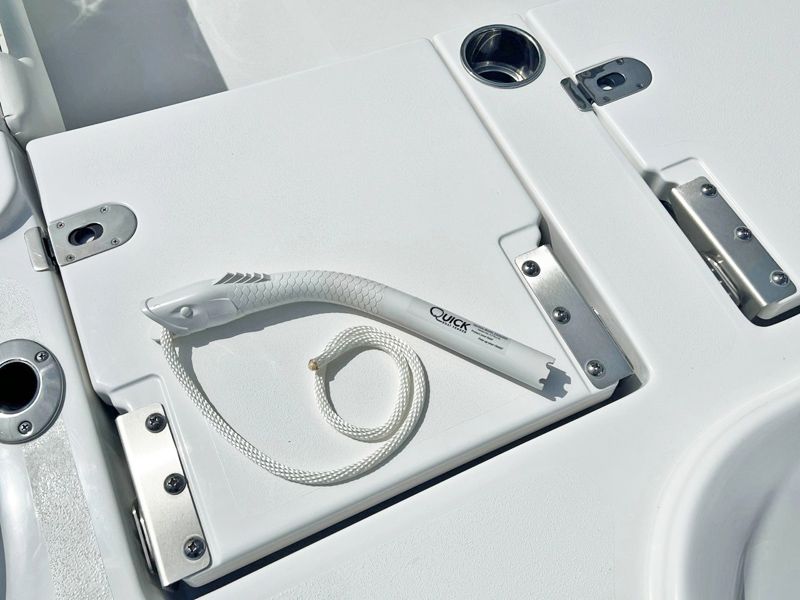 a white boat has a rope attached to it that says click