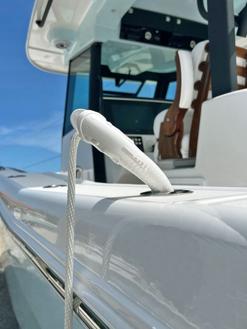 A white boat with a rope attached to the side