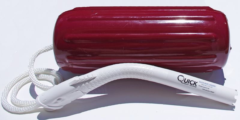 A red fender with a white rope attached to it