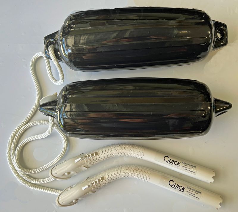 two black fenders with white handles that say quick on them