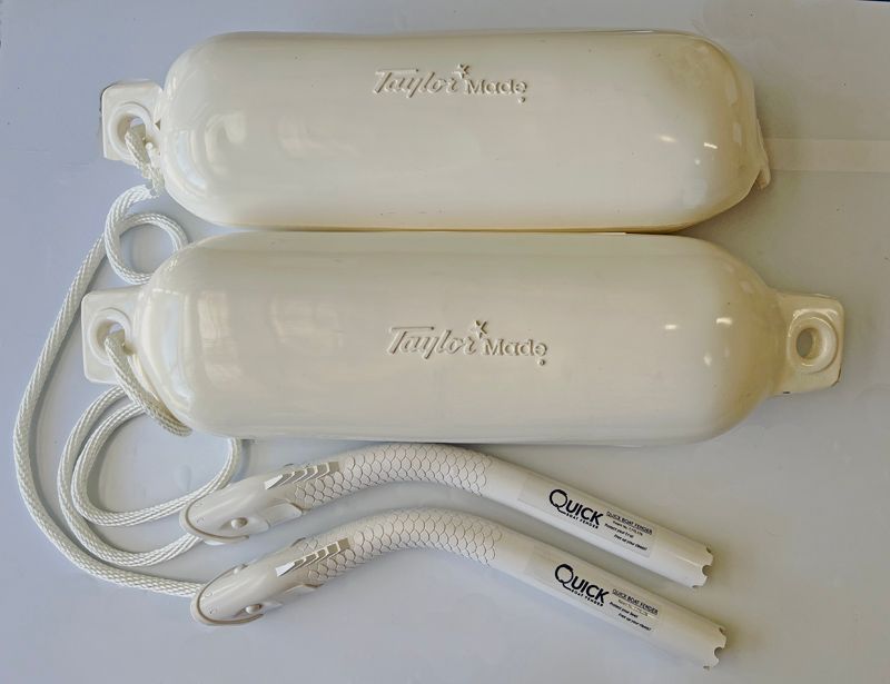 a pair of white fenders made by taylor made