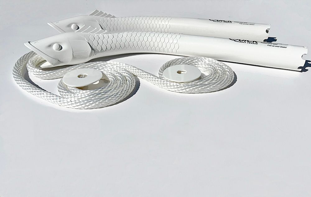 A pair of white fish shaped rope holders on a white surface