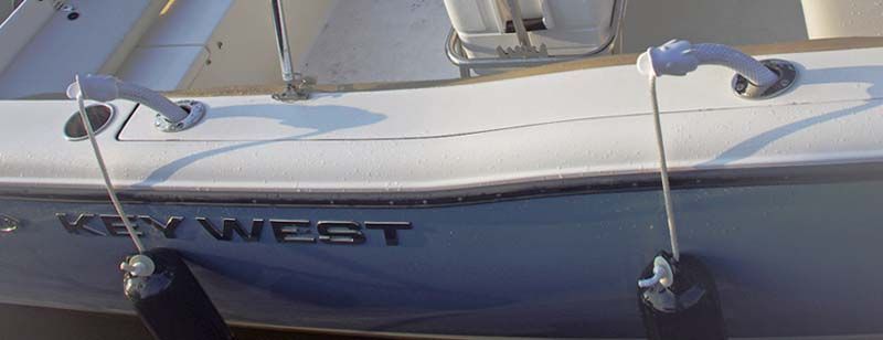 The name key west is on the side of a boat.