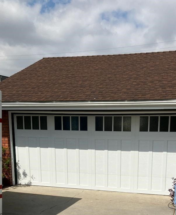 A white garage door with a brown roof in Yucaipa