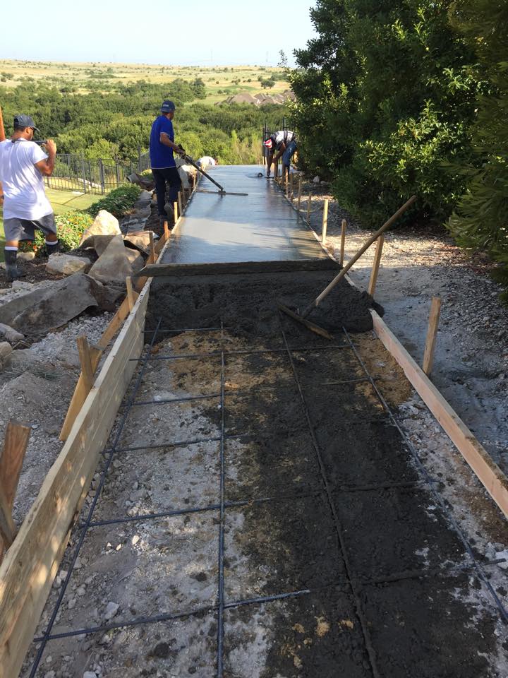 Construction Workers Troweling Wet Concrete — Fort Worth, TX — H & H Concrete On Demand