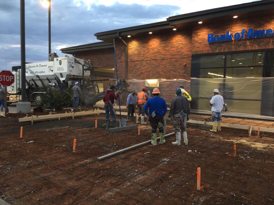 Construction Workers Finishing Concrete On Ground — Fort Worth, TX — H & H Concrete On Demand