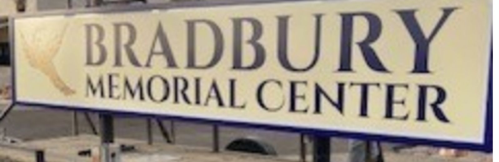 Bradbury Memorial Center sign with large brown lettering on a light background
