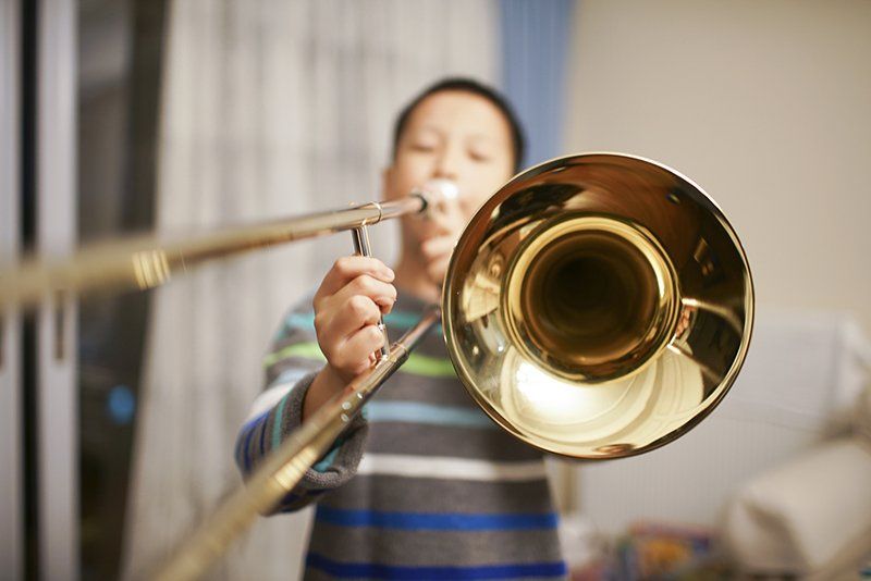 A boy playing trumpet