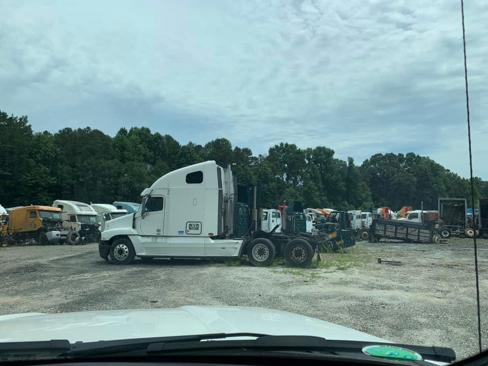 Sideview Of  White Truck ā Gillsville, GA ā Simpson & Simpson LLC