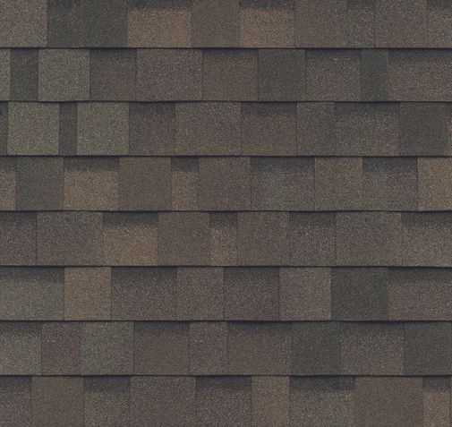 A close up of a row of brown shingles on a roof.