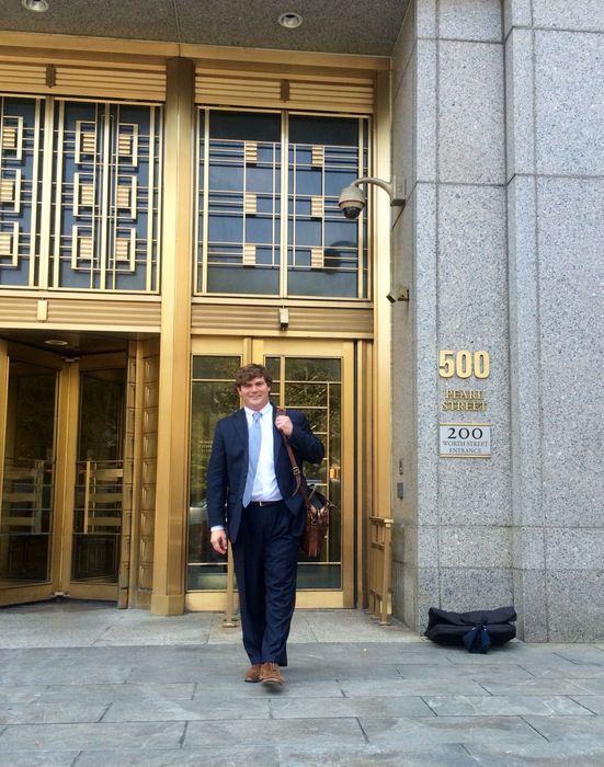 Wesley D. Ehrhardt standing in front of Daniel Patrick Moynihan United States Courthouse