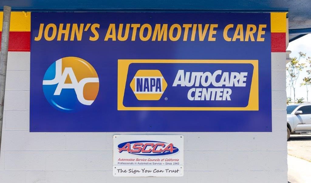 Logo and NAPA Auto Care Center Outside of shop | John's Automotive Care El Cajon