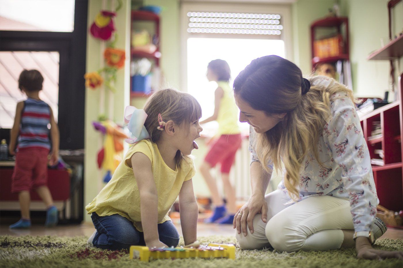 A Teacher and a Cute Little  Girl Communicating — Bridgeport, CT — Donna's Little Doves Inc.