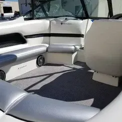 The inside of a boat with a lot of seats and a bench.