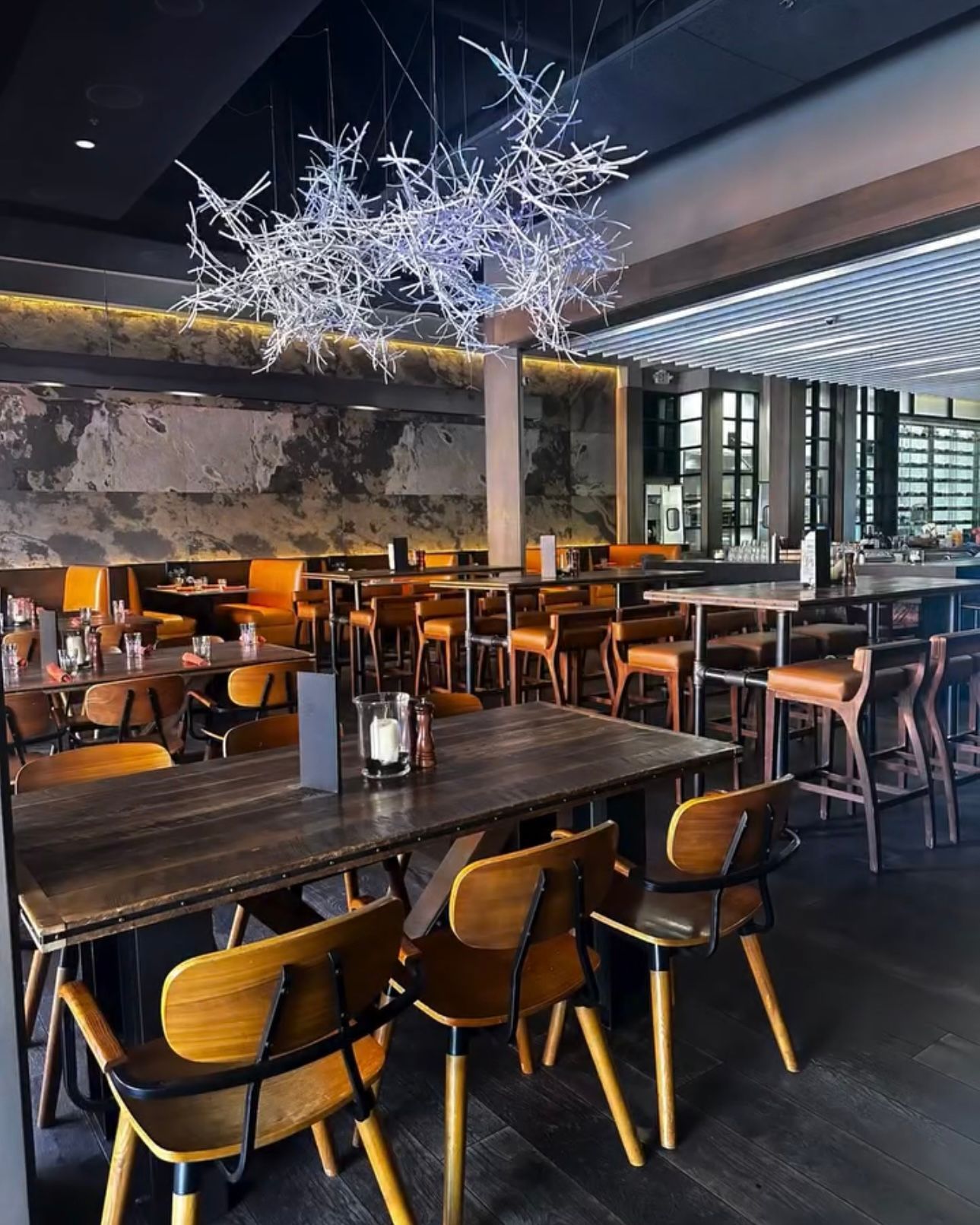 A restaurant with a lot of tables and chairs