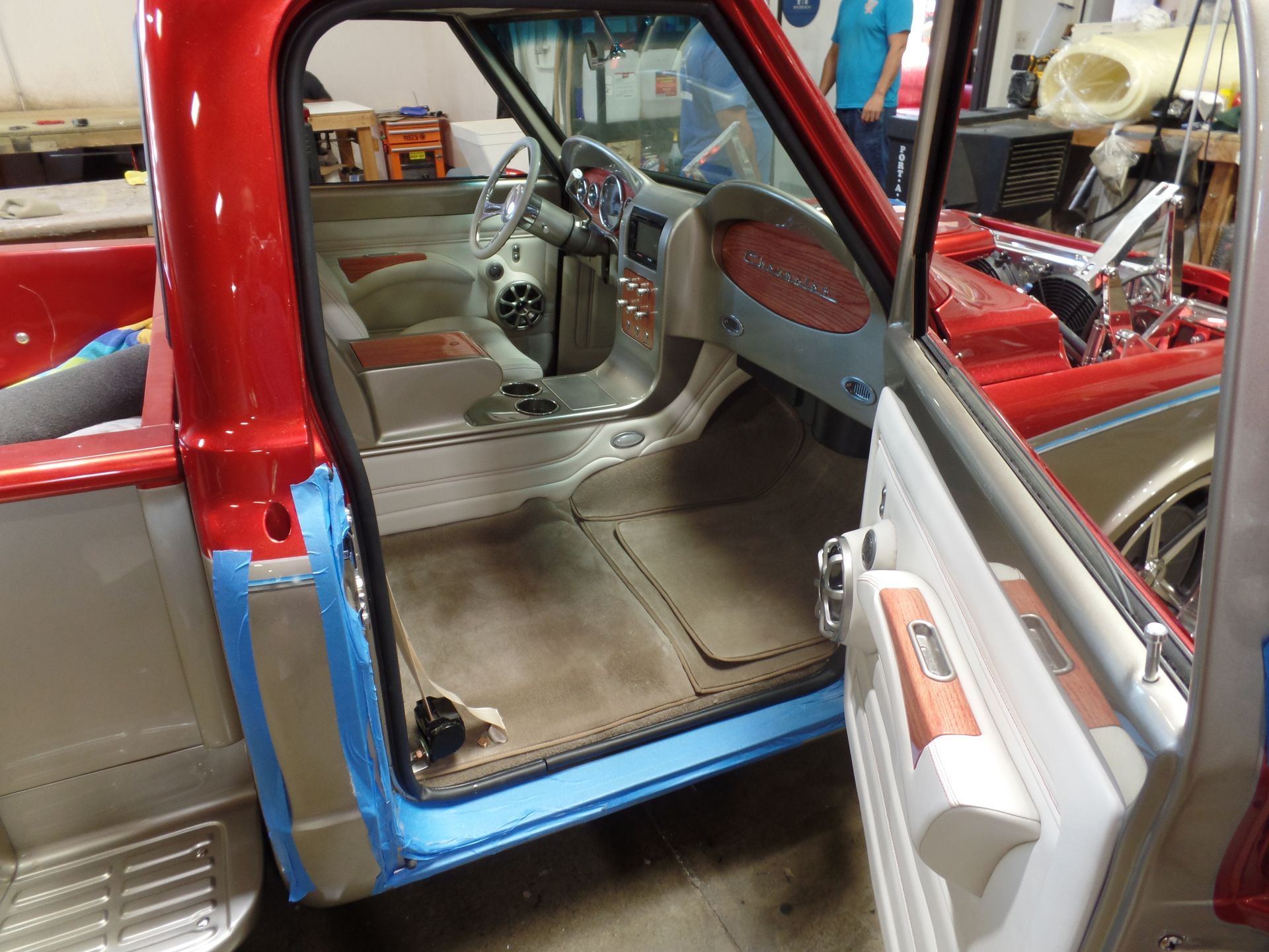 The inside of a red truck with the door open