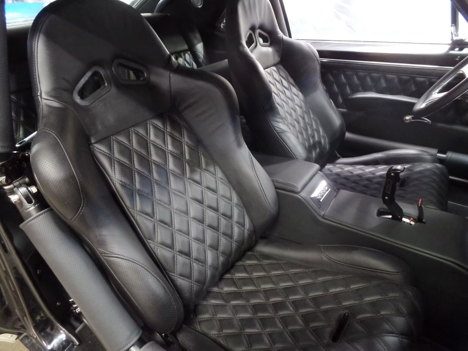 A car with black seats and a steering wheel