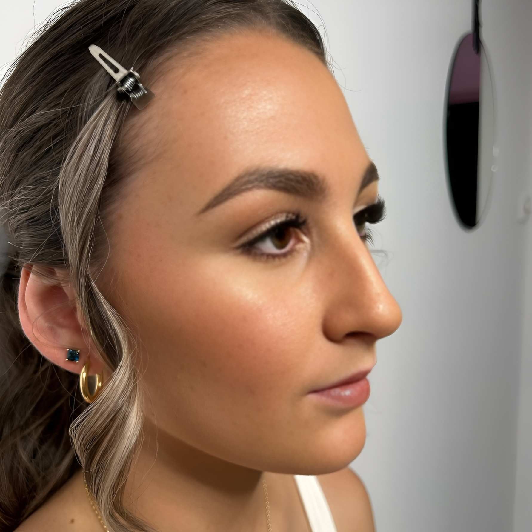 Woman With Styled Hair, Wearing Gold Hoop Earrings — Admire Skincare and Beauty in Taree, NSW
