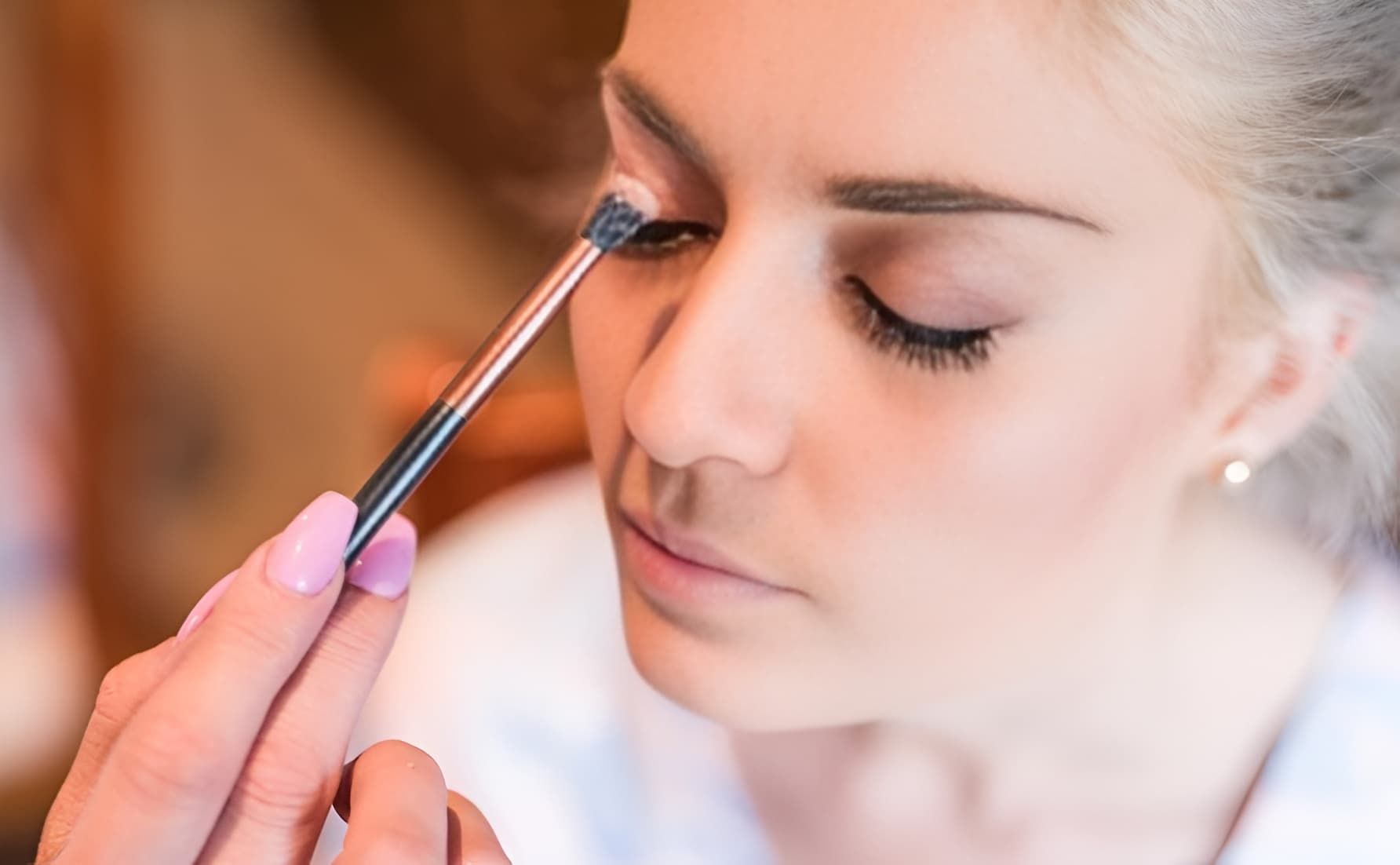 Woman Getting Eye Makeup Applied With a Brush — Admire Skincare and Beauty in Taree, NSW