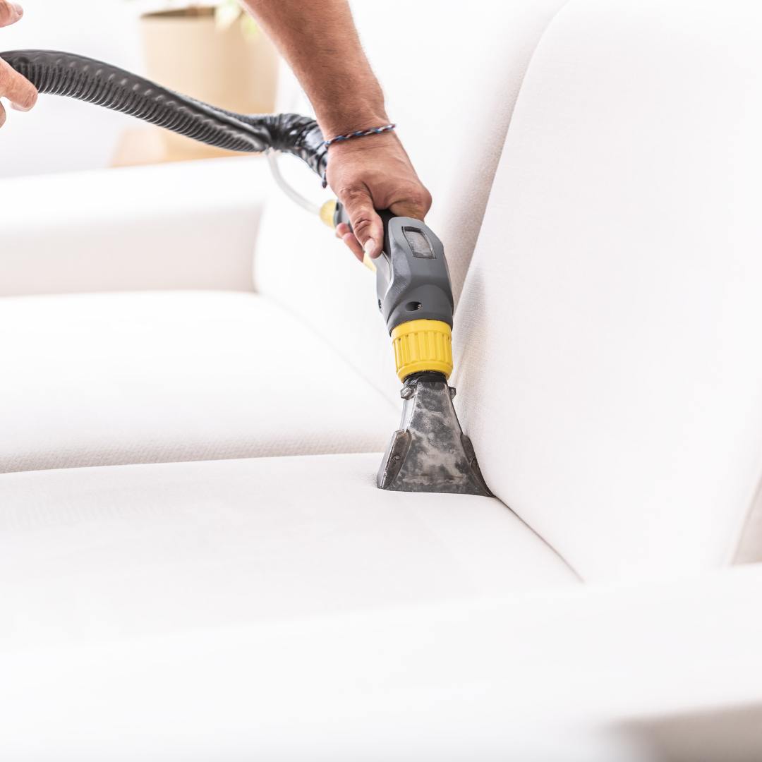 Vaccum cleaning a couch