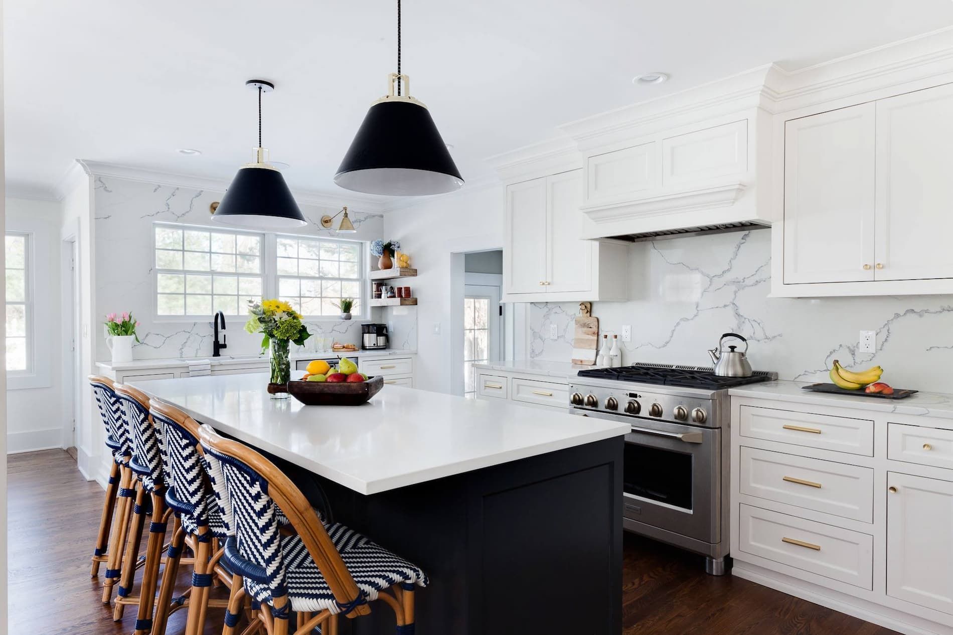 A Kitchen with White Cabinets, Stainless Steel Appliances, and A Large Island — Taree Paint Centre in Taree, NSW