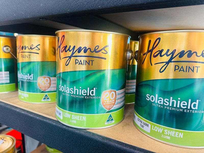 Several Cans of Haynes Paint Are on A Shelf — Taree Paint Centre in Taree, NSW