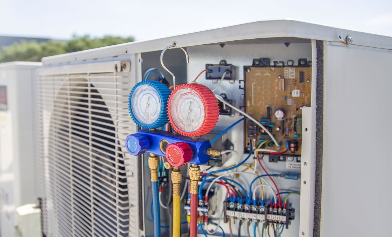 Two slices of toasted bread topped with diced tomatoes, onions, olives, and herbs.