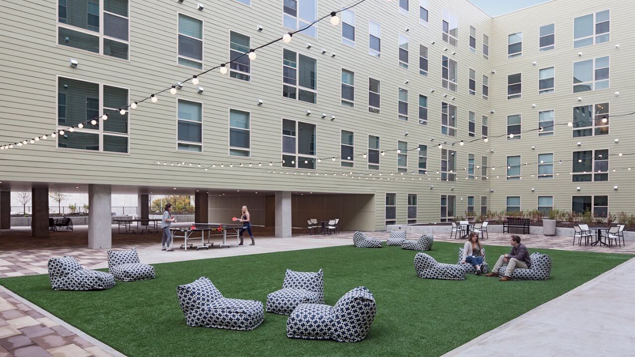 Courtyard with Garden Lights & Lounge Chairs at Latitude.