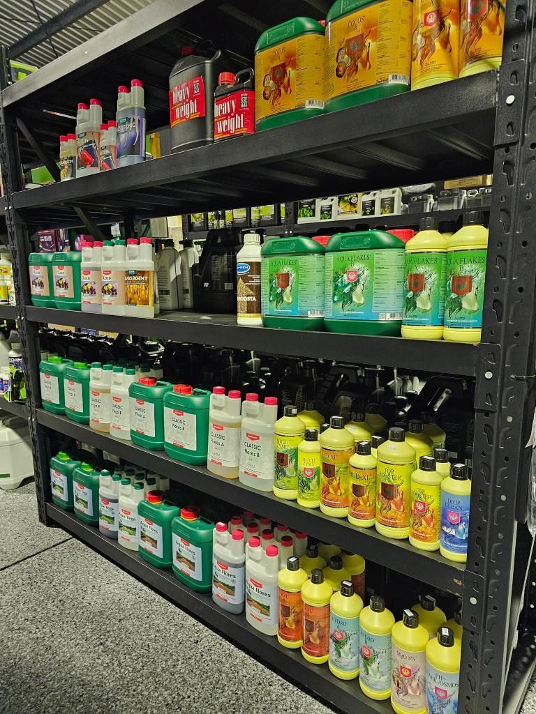 A Shelf Filled With Lots of Bottles of Chemicals in a Store — Wide Bay Hydroponics In Gympie, QLD