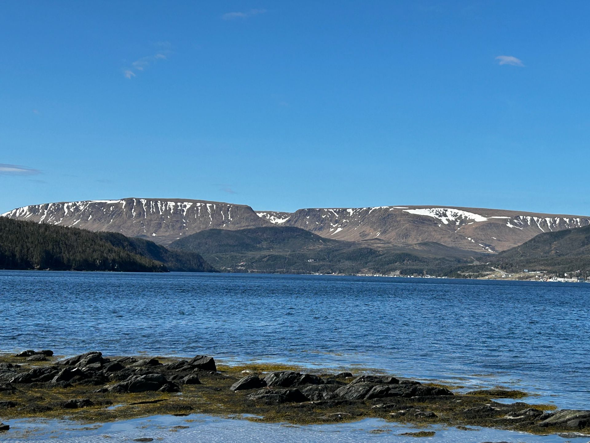 A large body of water with mountains in the background