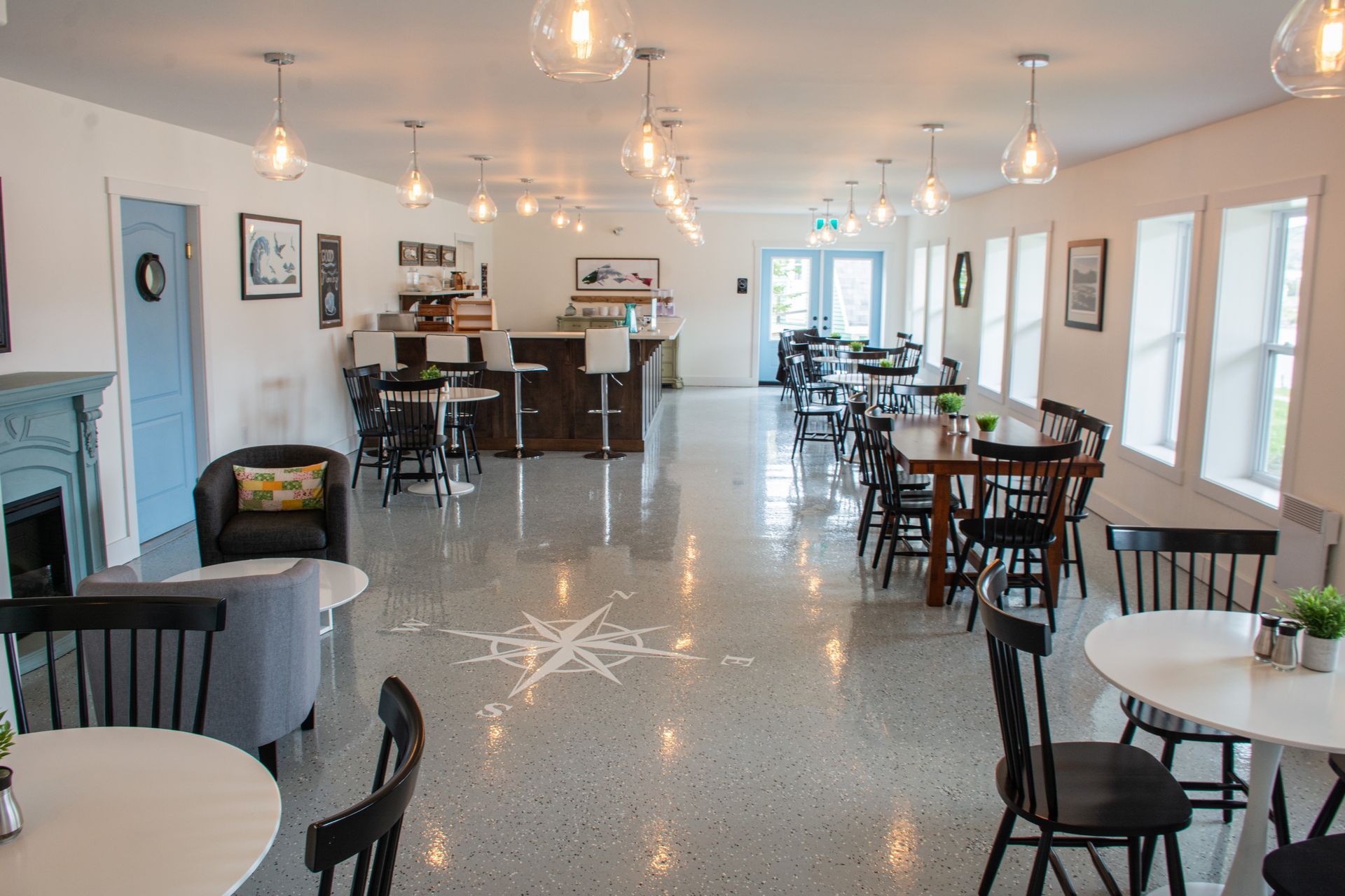 A large room with tables and chairs in it.