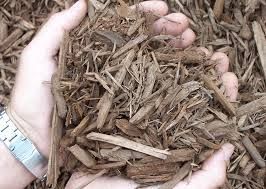 Natural organic light brown wood chips perfect for top dressing of flower beds