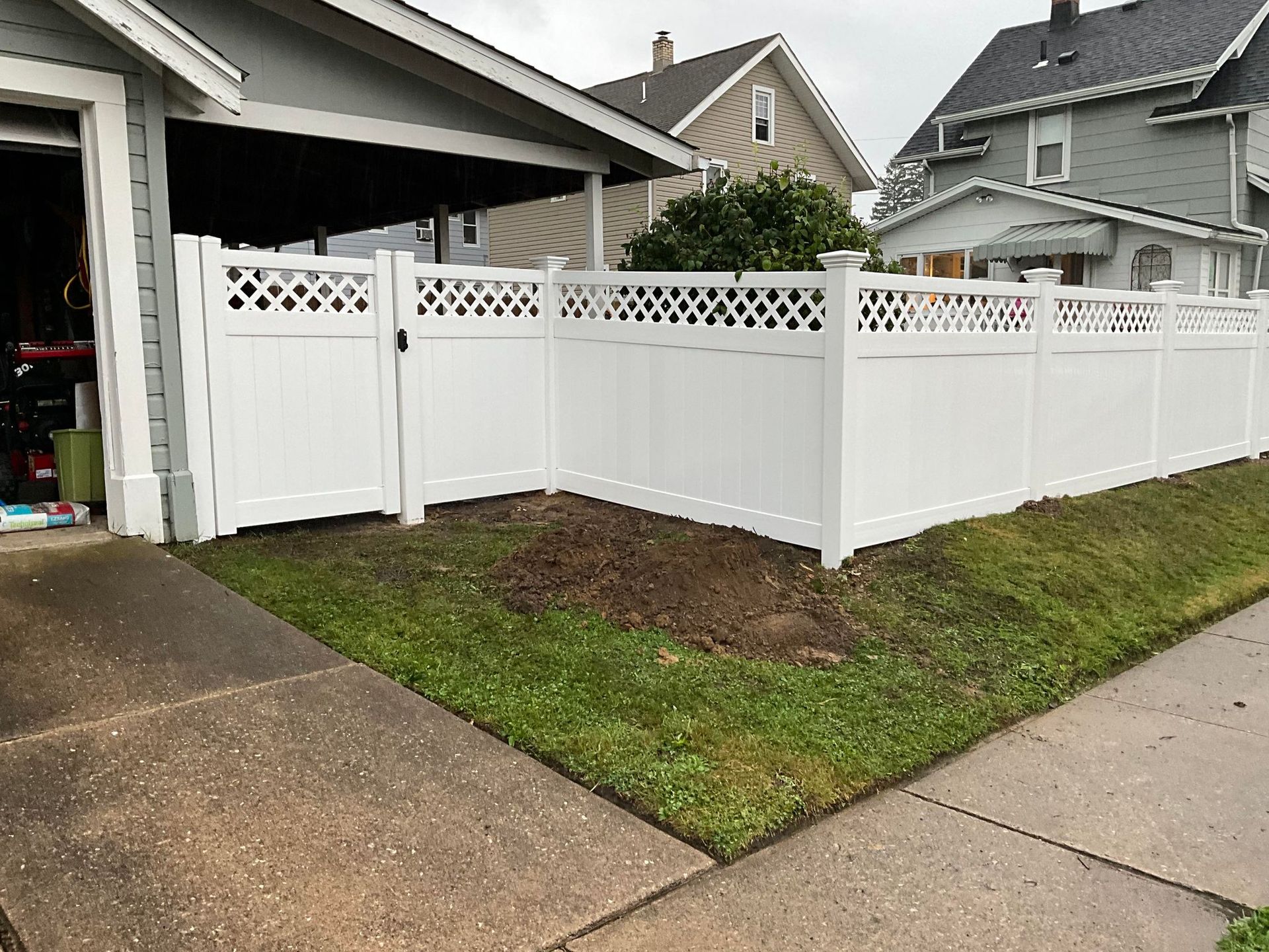 White Fence Surrounding A Blue Pool - Erie, PA - Harbor Fence Co.