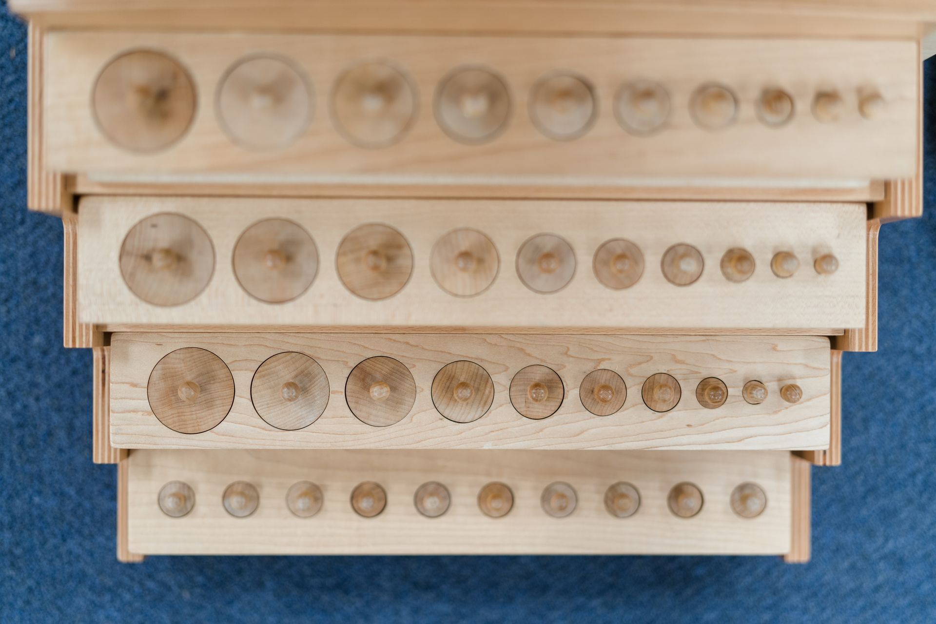 Montessori knobbed cylinders.