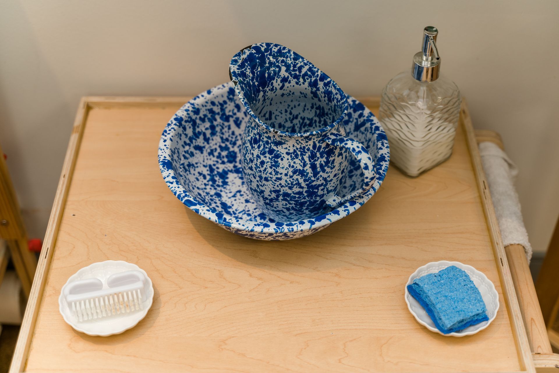 A blue and white bowl is sitting on top of a wooden table.