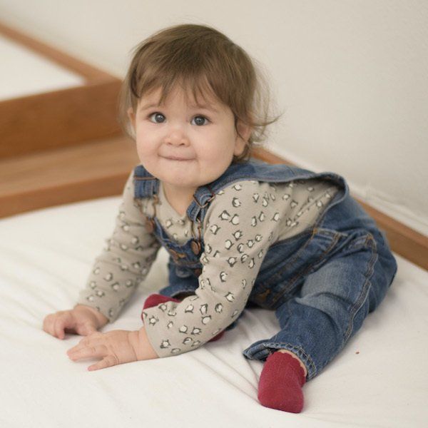 Montessori infant smiling in the classroom