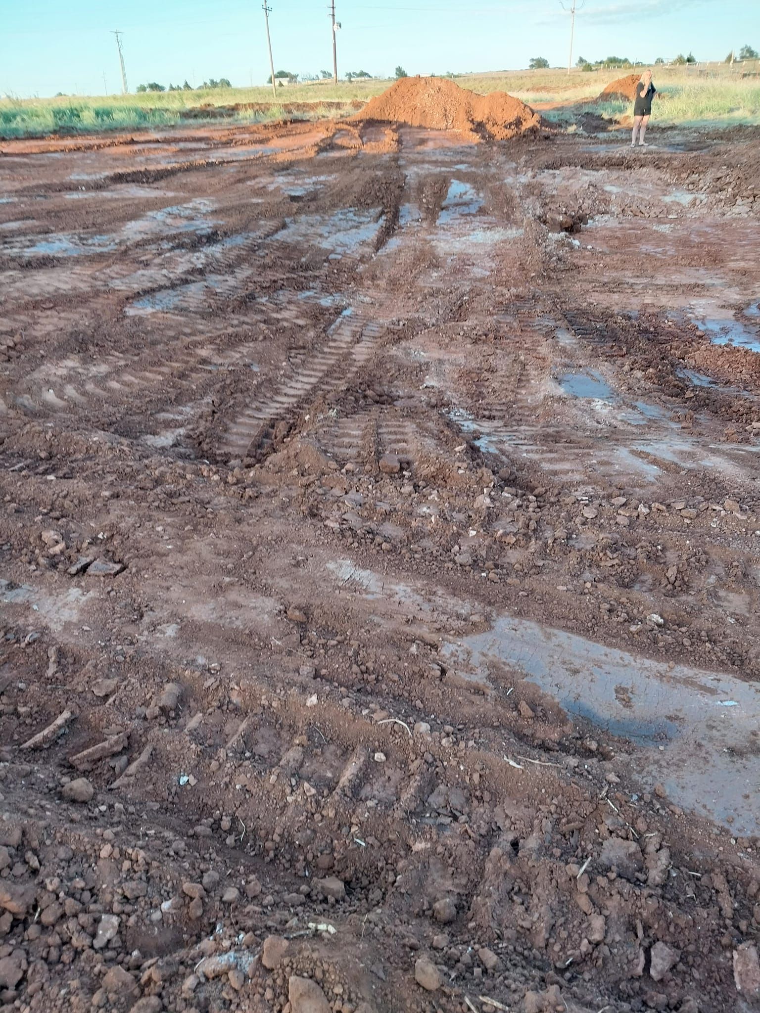 A muddy field with a lot of dirt and water.